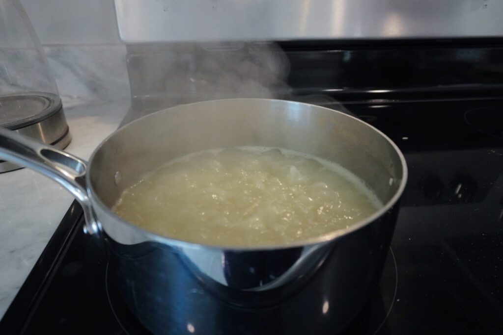 pot of rice boiling on the stove
