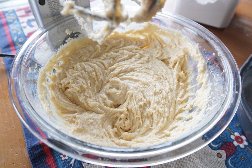 a glass mixing bowl of batter