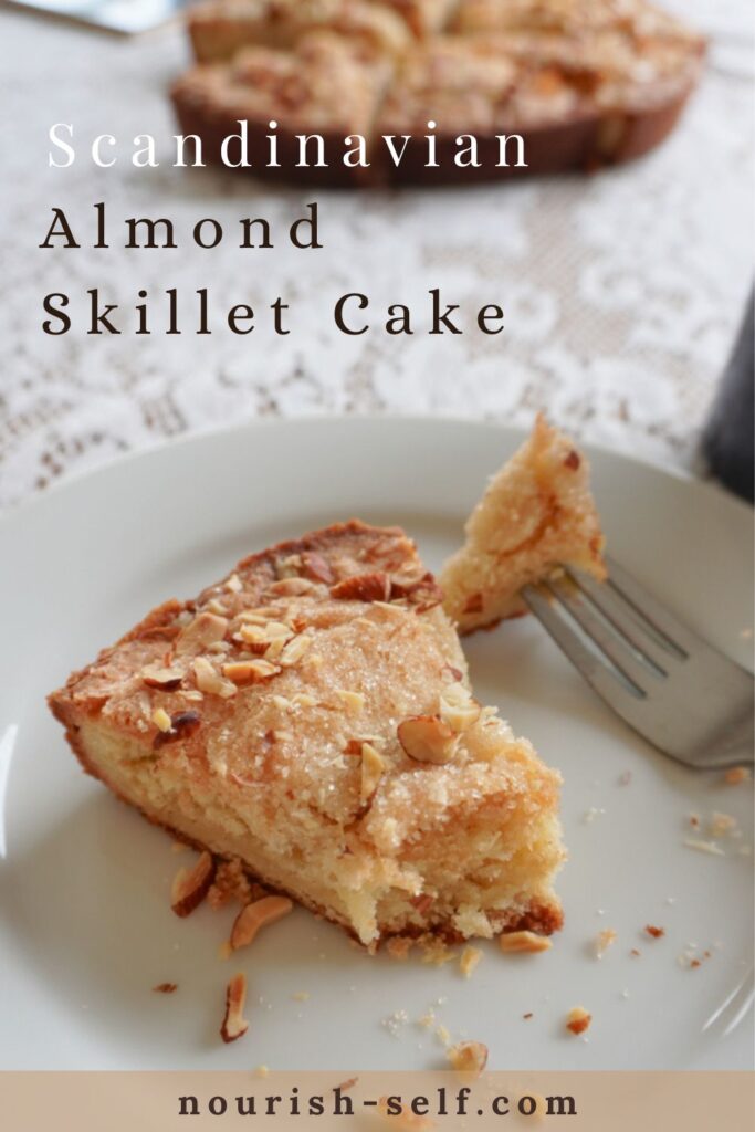 Pinterest pin of a slice of Scandinavian Almond Skillet Cake