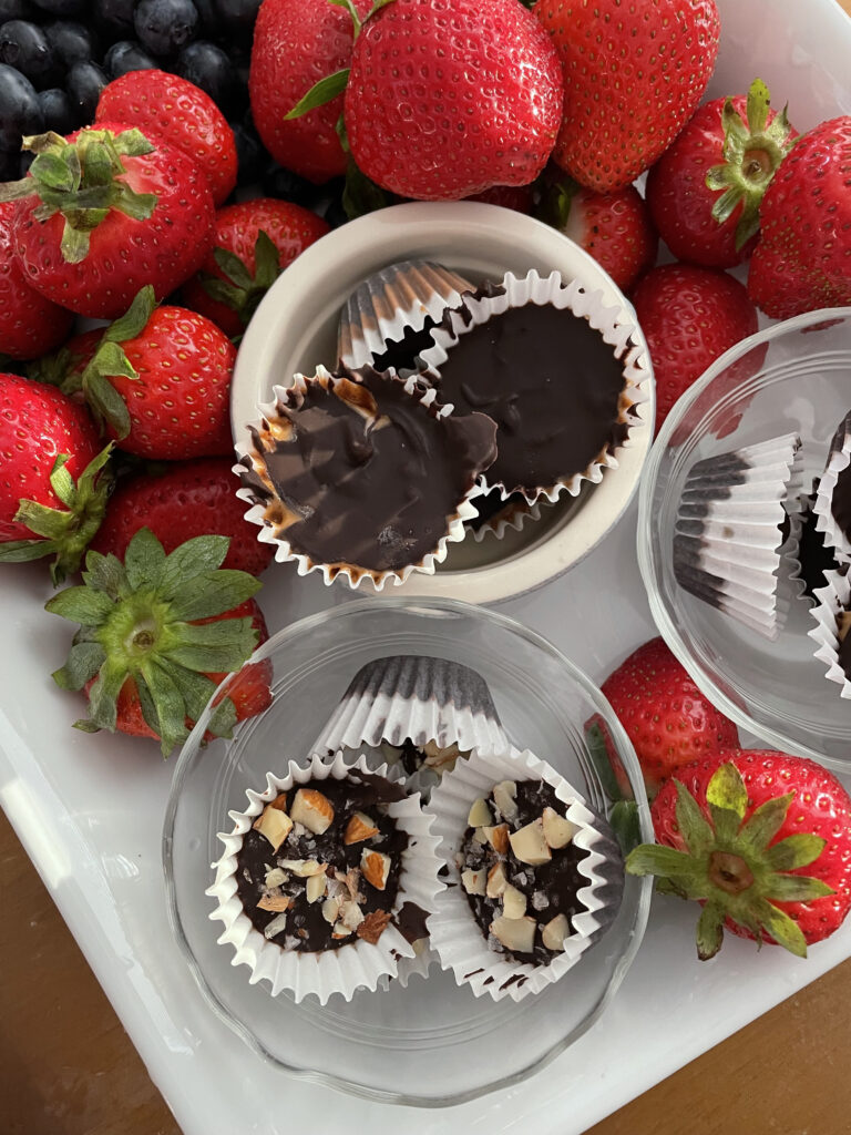a platter of strawberries and chocolates