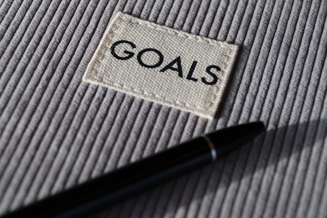 a goals patch on a grey background